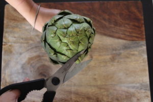Kitchen scissors used to cut the tips of the artichoke petals to remove the thorns.